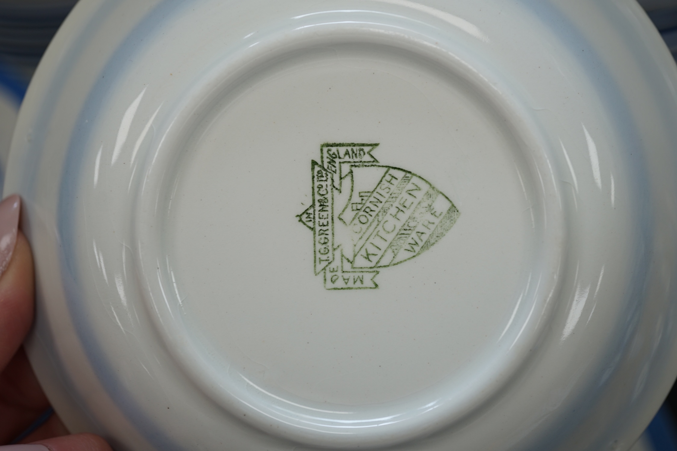 T.G.Green Cornish Kitchenware, a collection of approximately sixty assorted plates, bowls and dishes, largest 26cm diameter, Green Shield marks. Condition - fair to good